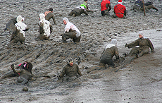 The team getting to grips with the mud on 'the hill'